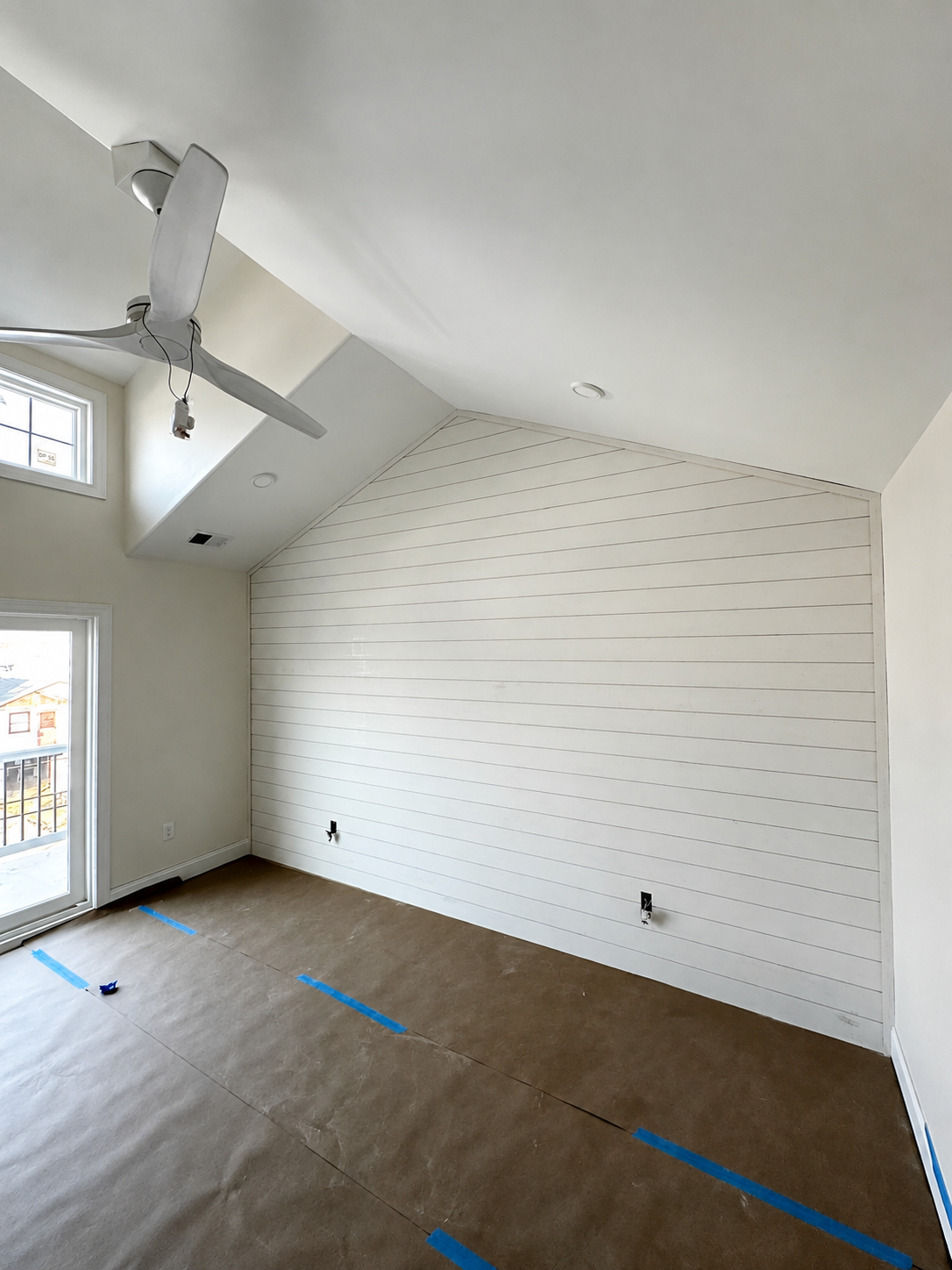 Completed white shiplap accent wall