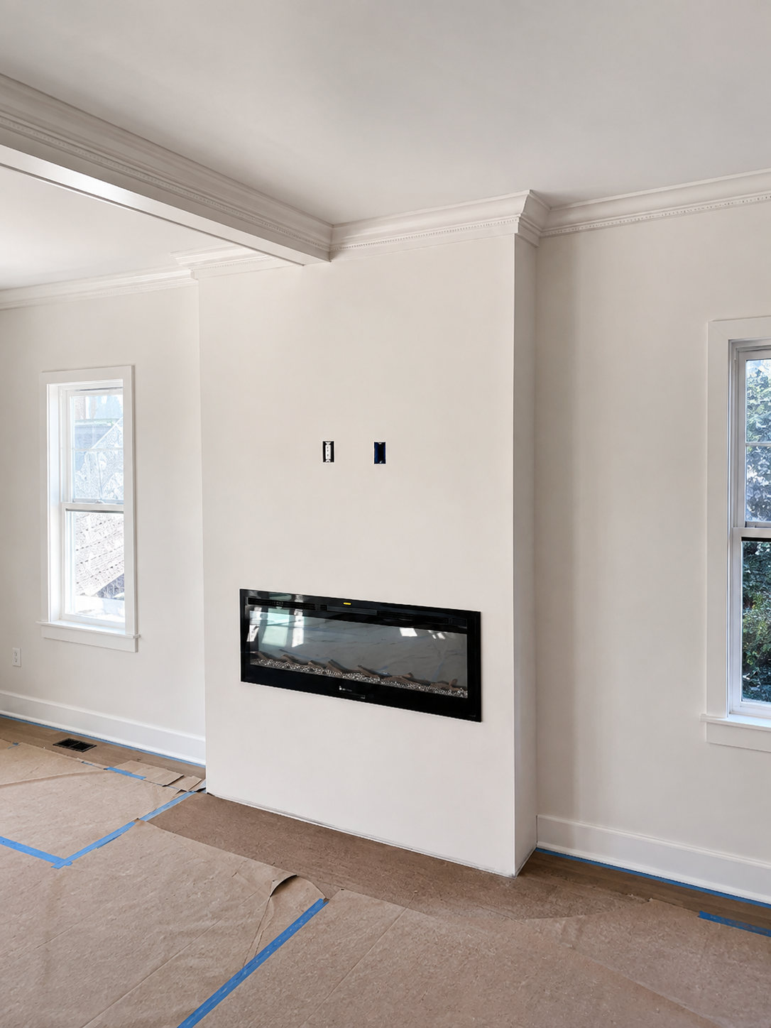 Fireplace wall before vertical slat feature installation