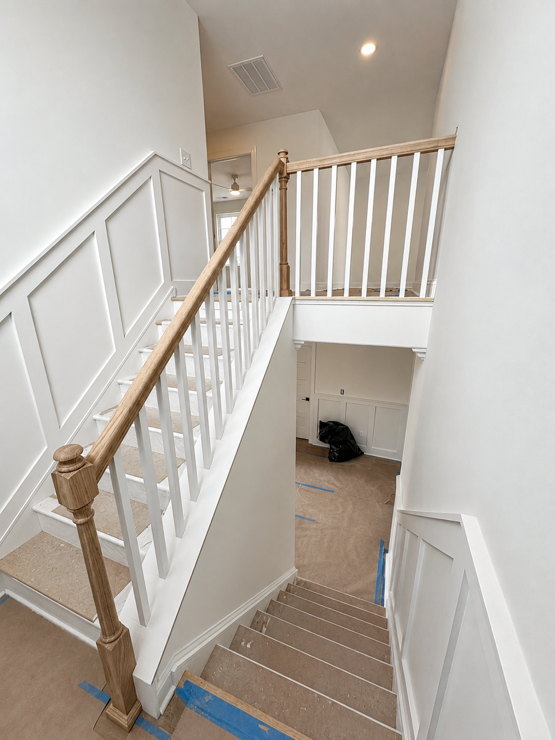 Finished stair railing and trim with clean custom detailing