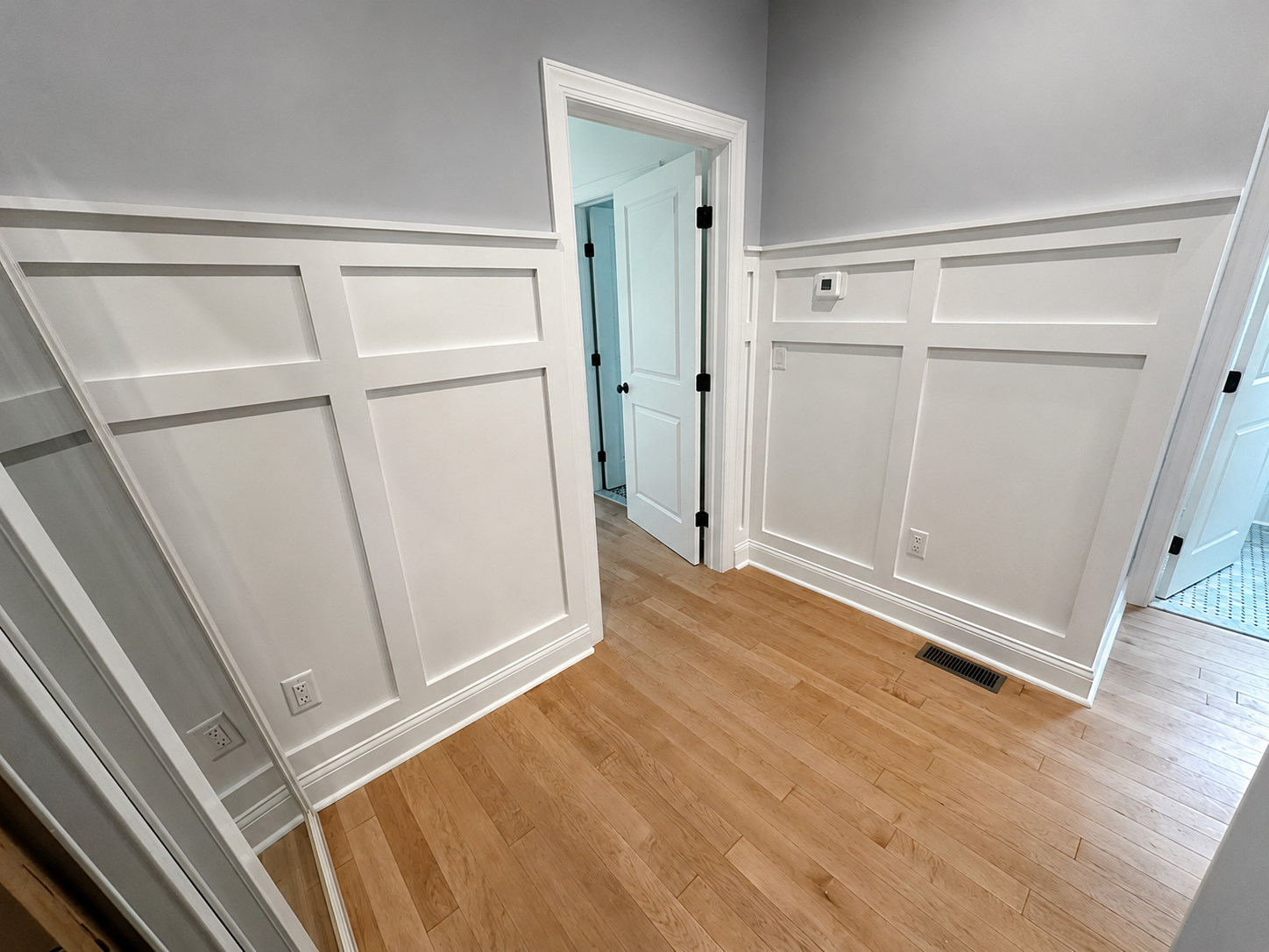 Completed wall paneling in a bright finished interior