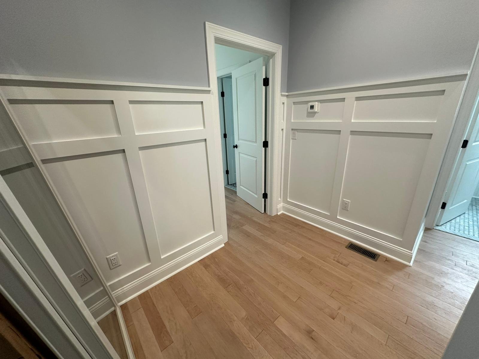 Completed wall paneling in a bright finished interior